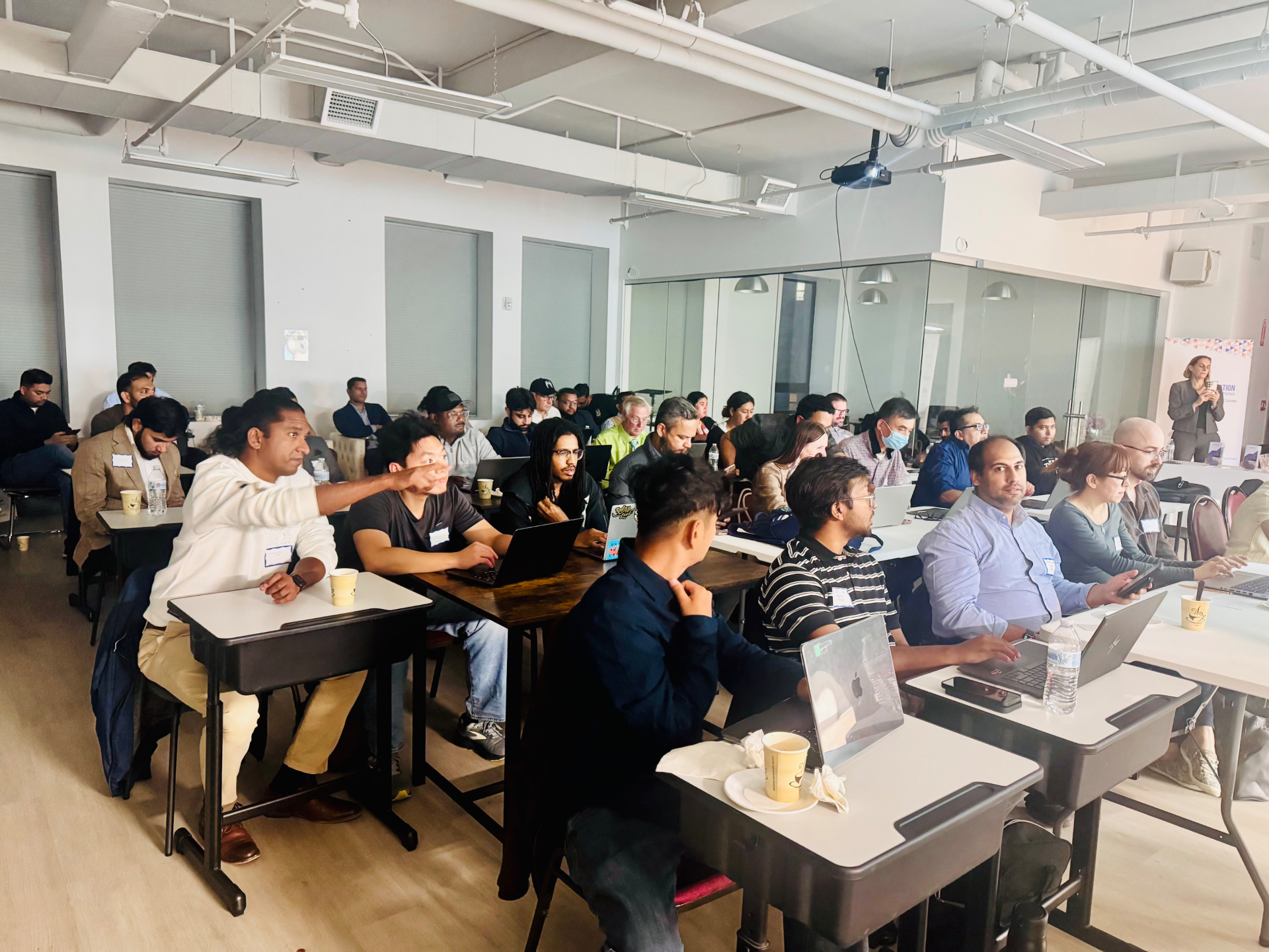 Business owners with laptops at one of our AI classes